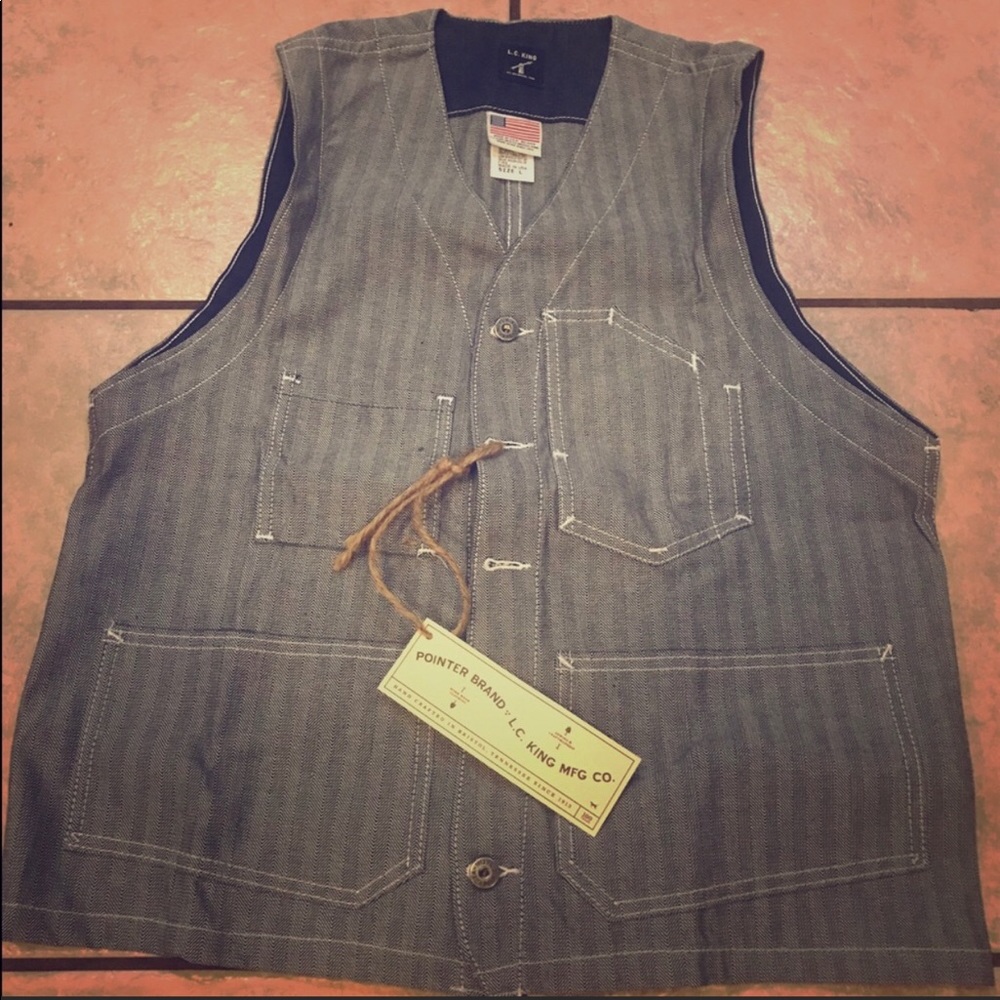 Men’s vest with tags and receipt